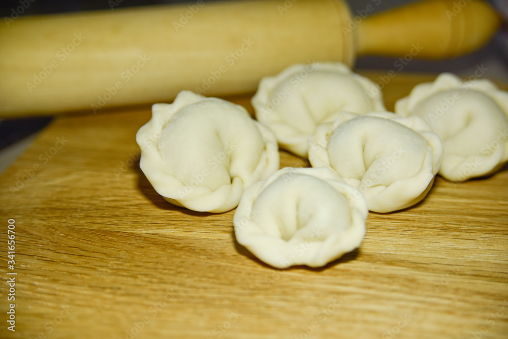 Five dumplings of round shape on the wooden deck. Five dumplings of round shape on the wooden deck.