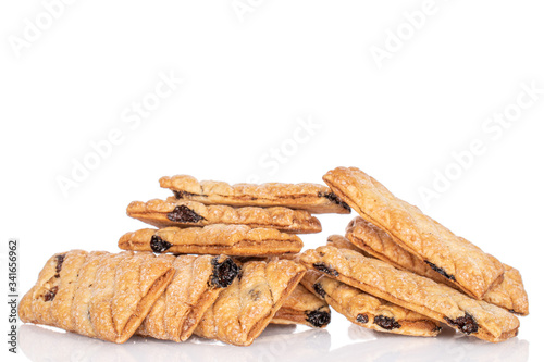 Lot of whole square puff cookie with raisins heap isolated on white
