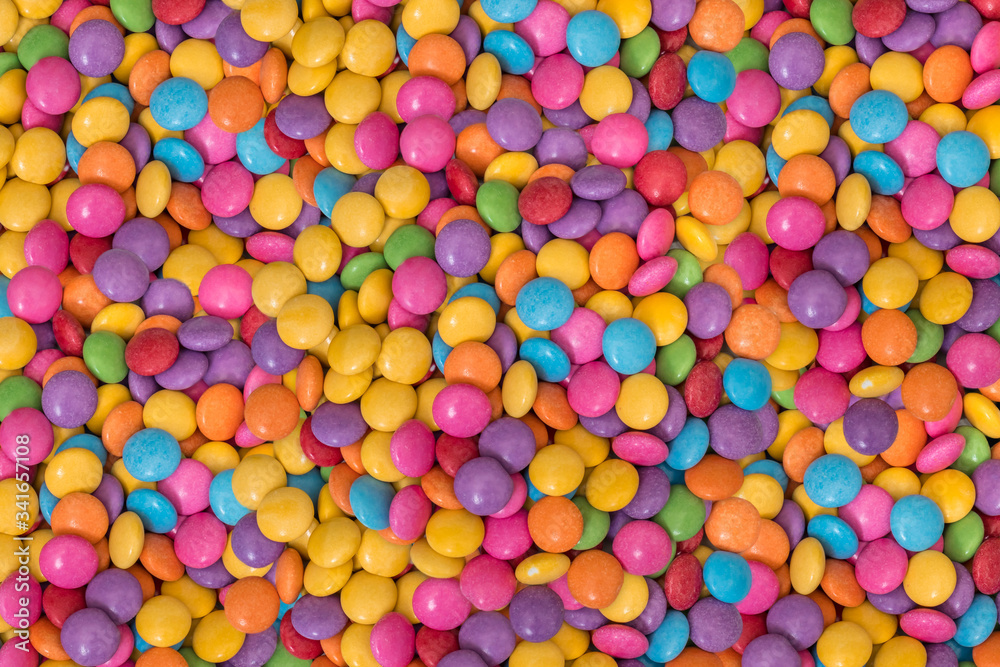 Color chocolate candies - smarties background Color chocolate candies - smarties background