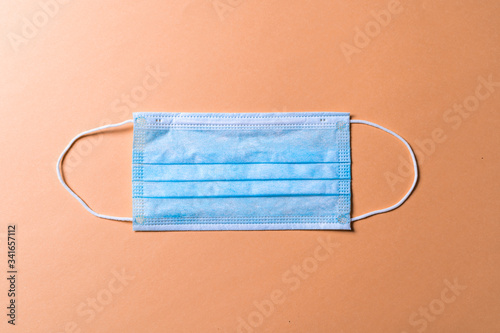 Medical protective mask on background. Disposable surgical face mask cover the mouth and nose.