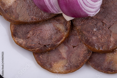 Meat plate with meat stock with red onions photo