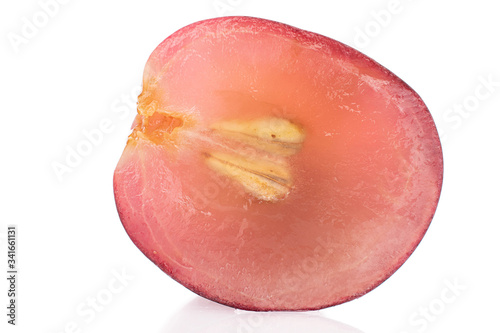 One half of fresh red globe grape cross section isolated on white
