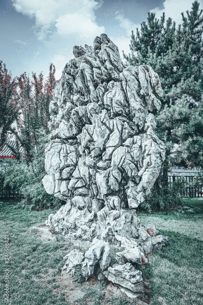 Fototapeta premium Typical Chinese garden, park with bizarre rocks. Beijing.