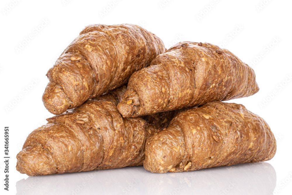 Group of four whole baked wholegrain croissant isolated on white Group of four whole baked wholegrain croissant isolated on white