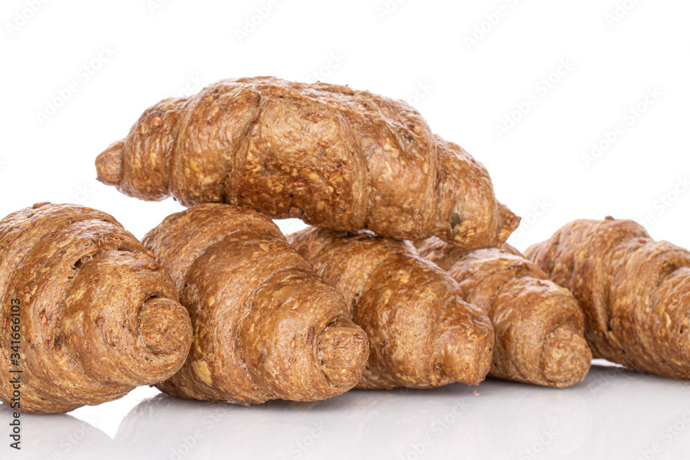 Lot of whole baked wholegrain croissant isolated on white Lot of whole baked wholegrain croissant isolated on white
