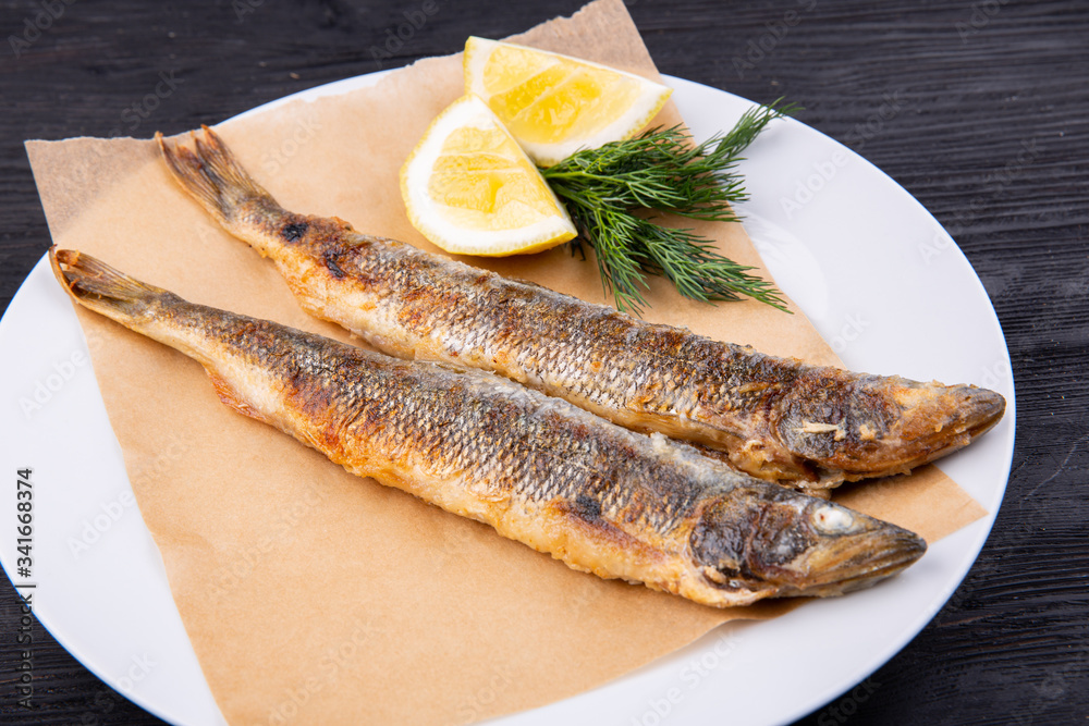 Mackerel grilled, served with lemon and dill Mackerel grilled, served with lemon and dill