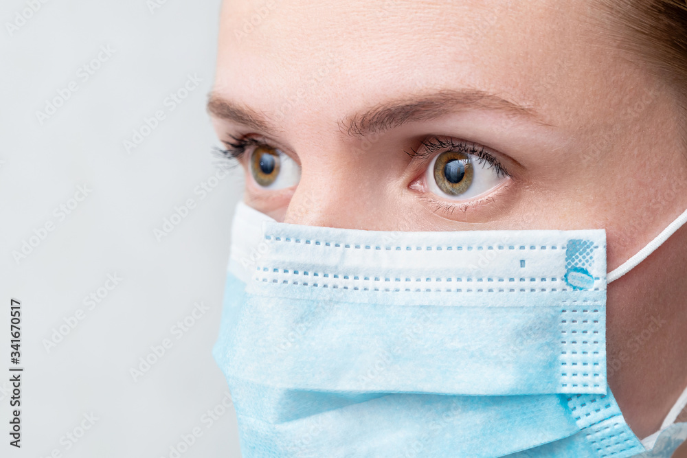 Woman in respiratory mask, closeup portrait. Influenza, quarantine, coronavirus, covid-19 Woman in respiratory mask, closeup portrait. Influenza, quarantine, coronavirus, covid-19