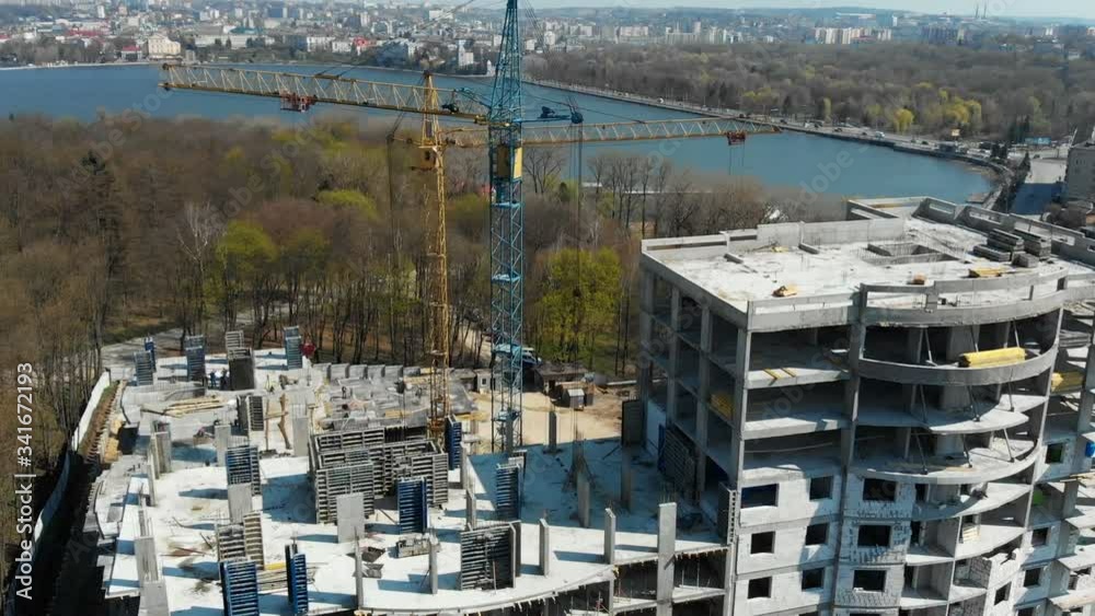 Flight over the industrial building of a multi-storey building not far from the sea. View from above. Flight over the industrial building of a multi-storey building not far from the sea. View from above.