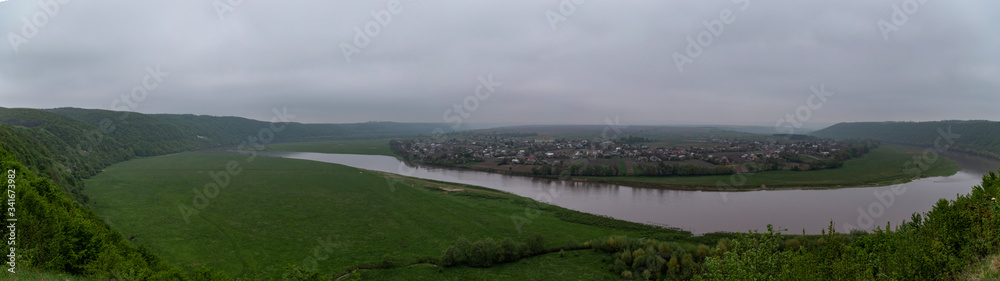 panorama view of the Dniester River in cloudy weather in early spring panorama view of the Dniester River in cloudy weather in early spring