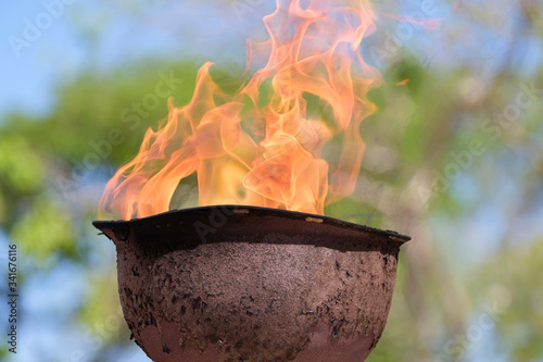 memorial fire in a soldiers helmet