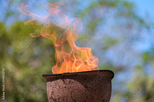 memorial fire in a soldiers helmet
