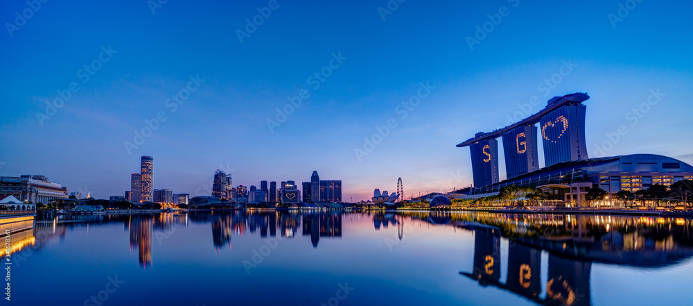 Super wide panorama of Singapore skyscrapers at morning magic hour