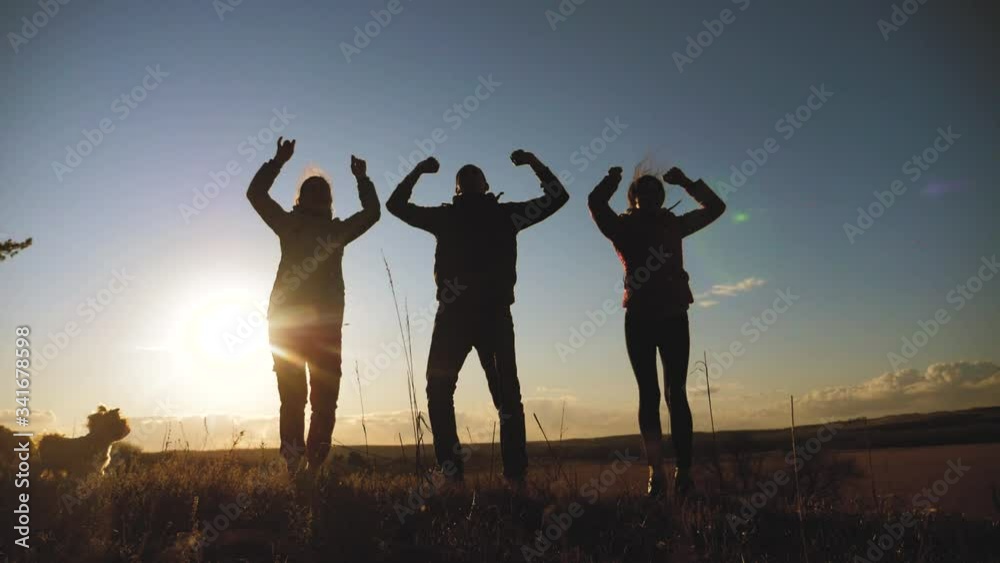 happy family teamwork silhouette jumping for joy and happiness. concept success victory in business goal achievement. a group lifestyle of people jump rejoice shout
