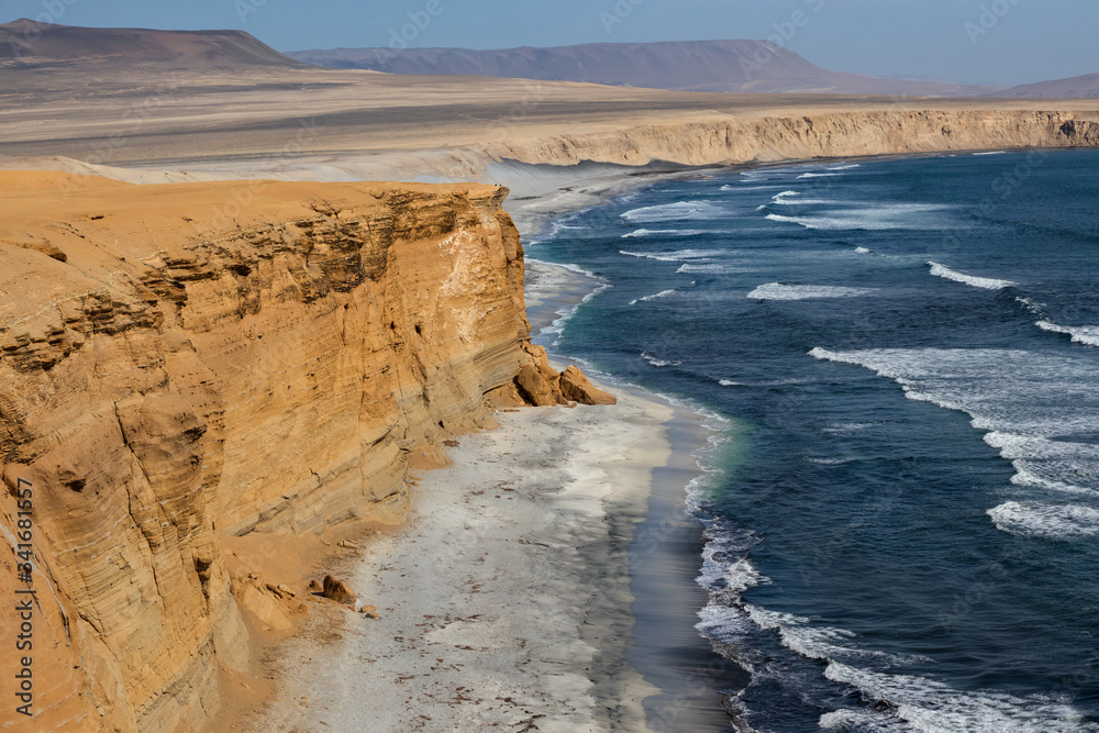 Cliffs on the shore Pacific Ocean in Paracas National Reserve, Peru.