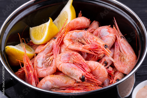 Boiled shrimp, served with lemon and cream sauce photo