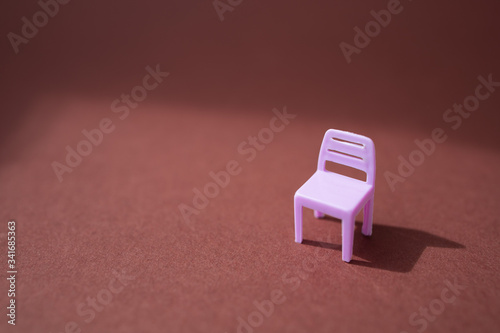 One chair in the epty room. Minimal pandemic and incarceration in state of quarantine concept. Social problems. The consequences of coronavirus. Creative background. Copy space.