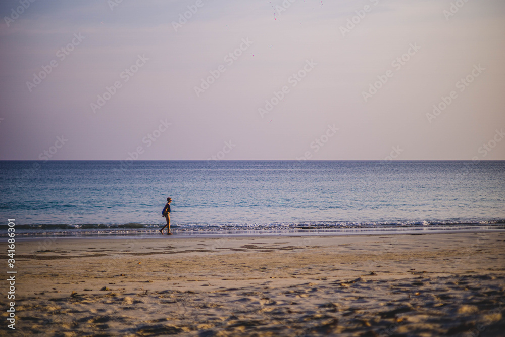 girl walking on the beach