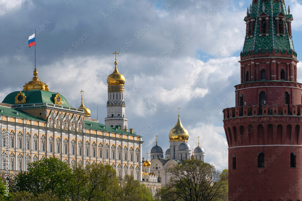 Symbol of Russia. Moscow Kremlin (Grand Kremlin Palace with the national flag of Russia, Ivan the Great bell tower, Archangel Cathedral and Water tower).