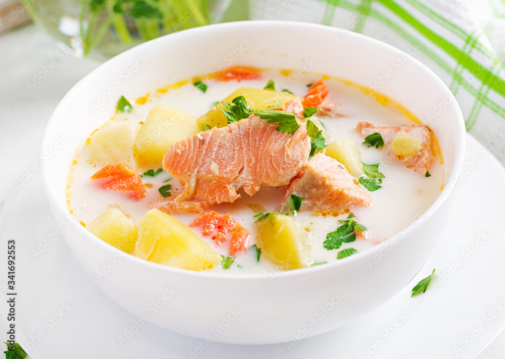 Kalakeitto. Creamy soup with salmon, potatoes, onions and carrots and in a bowl. Finnish/ karelian cuisine. Lohikeitto Kalakeitto. Creamy soup with salmon, potatoes, onions and carrots and in a bowl. Finnish/ karelian cuisine. Lohikeitto