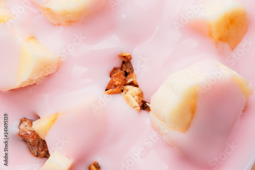 muesli in strawberry yogurt close up background