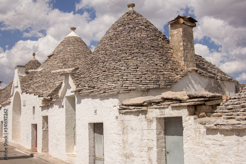The trulli of Alberobello is a traditional Apulian dry stone hut with a conical roof. Their style of construction is specific to the Itria Valley  in the Murge area of the Italian region of Apulia. 