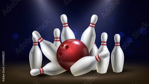 Red shiny bowling ball breaks white skittles on a dark background, winning hit