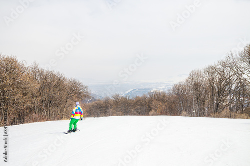 Girl snowboarding on the ski slope in Tsakhkadzor (Tsaghkadzor), Kotayk Province, Armenia