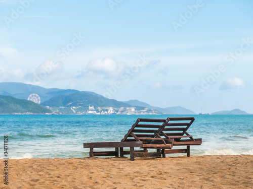 chair on the beach with island on background