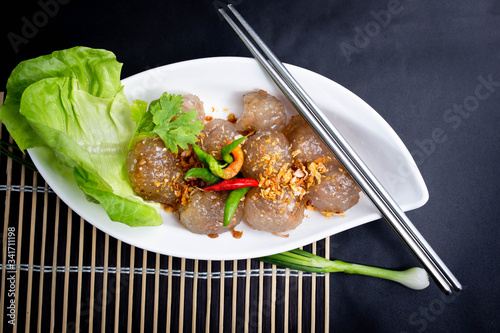 Thai snack Sakoo Sai Moo or steamed tapioca balls filled with pork recipe. Sago Pork Balls Thai Desserts. photo