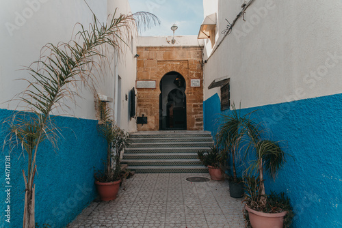 Small cozy streets in blue and white on a sunny day in the old city (medina) Kasbah of the Udayas (Oudaia). UNESCO heritage site. Rabat, Morocco photo
