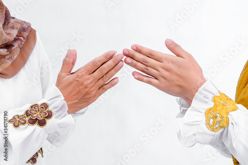 portrait of daughters and mothers hand gesture greet each other apologizing