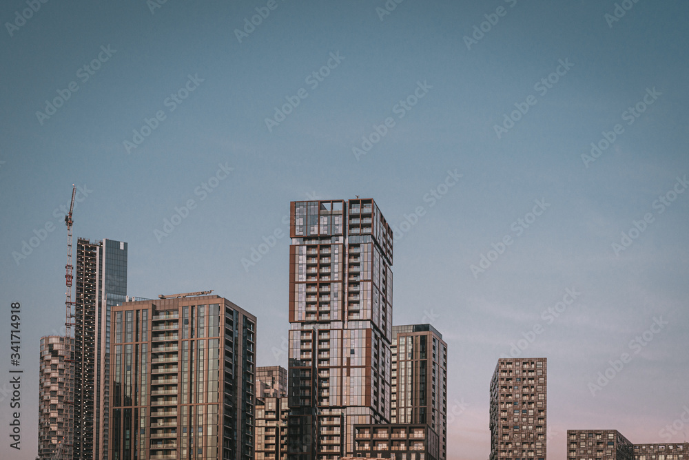 Modern city skyscrapers on blue sky Modern city skyscrapers on blue sky