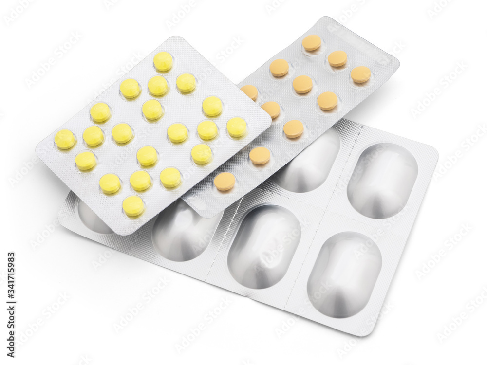 A large stack of tablets in a silver package on a white background, close-up, mock up. Prevention and treatment of diseases, viruses, coronavirus, flu and colds. The idea of medicine and healthcare A large stack of tablets in a silver package on a white background, close-up, mock up. Prevention and treatment of diseases, viruses, coronavirus, flu and colds. The idea of medicine and healthcare