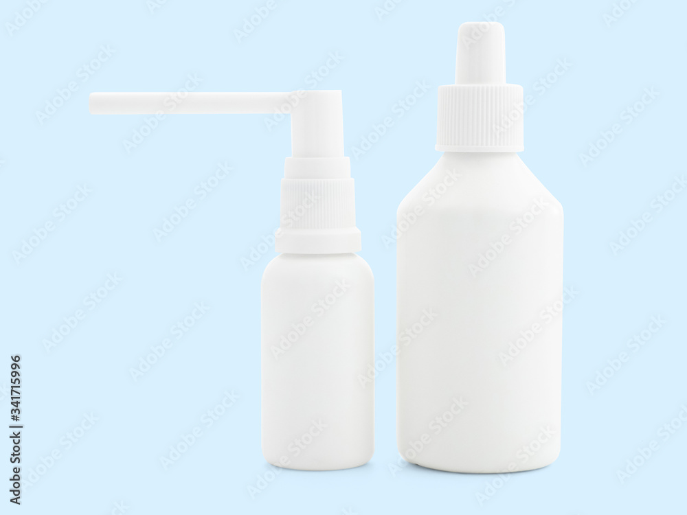 White spray on a colored background, isolate, close-up, mock up. Aerosol and antiseptic in the coronavirus and flu pandemic. A place for your label or brand. Blank for the designer White spray on a colored background, isolate, close-up, mock up. Aerosol and antiseptic in the coronavirus and flu pandemic. A place for your label or brand. Blank for the designer
