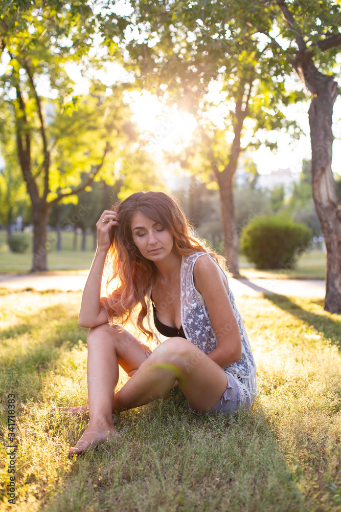 vertical portrait against the background of nature of a beautiful leggy twenty five year old woman vertical portrait against the background of nature of a beautiful leggy twenty five year old woman