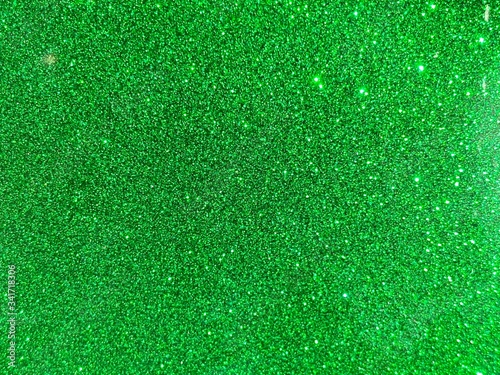 Green glitter vintage lights background. defocused