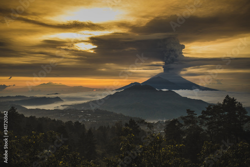 Series of photos from the eruption volcano Agung in Bali with beautiful views of the nature and volcano Batur. Big smoke and ash cover the sky 