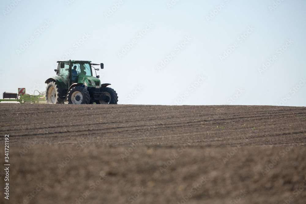 Agricultural truck working on the new crop of the spring season. Agricultural truck working on the new crop of the spring season.