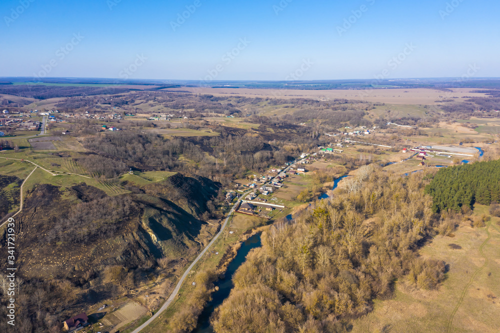 drone view of the river forest and village in Central Russia, spring Sunny day.