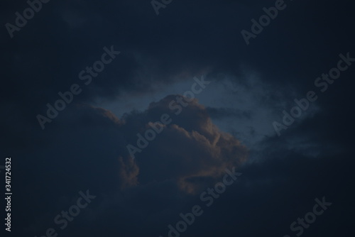 Dramatic sunrise and rainy storm sky with dark cloud.Abstract nature background.