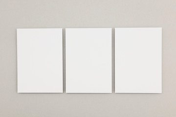 business card flyer poster mock up. White card on a grey background