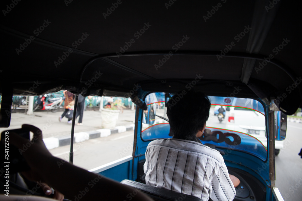 Rear View Of Man Driving Auto Rickshaw Stock Photo | Adobe Stock