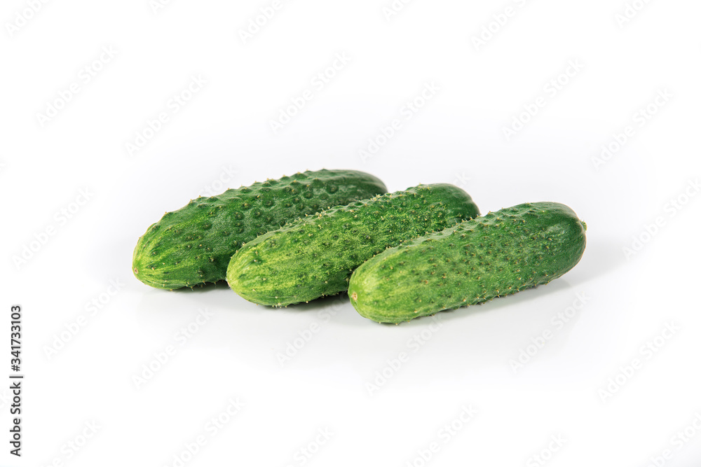 Group of fresh green pickling cucumbers on white background Group of fresh green pickling cucumbers on white background