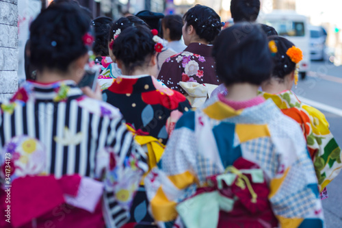 Asian Travel Destinations. Group of Female Geishas in Traditional Japanese Silk Kimono Walking on Street of Kyoto City, Japan.