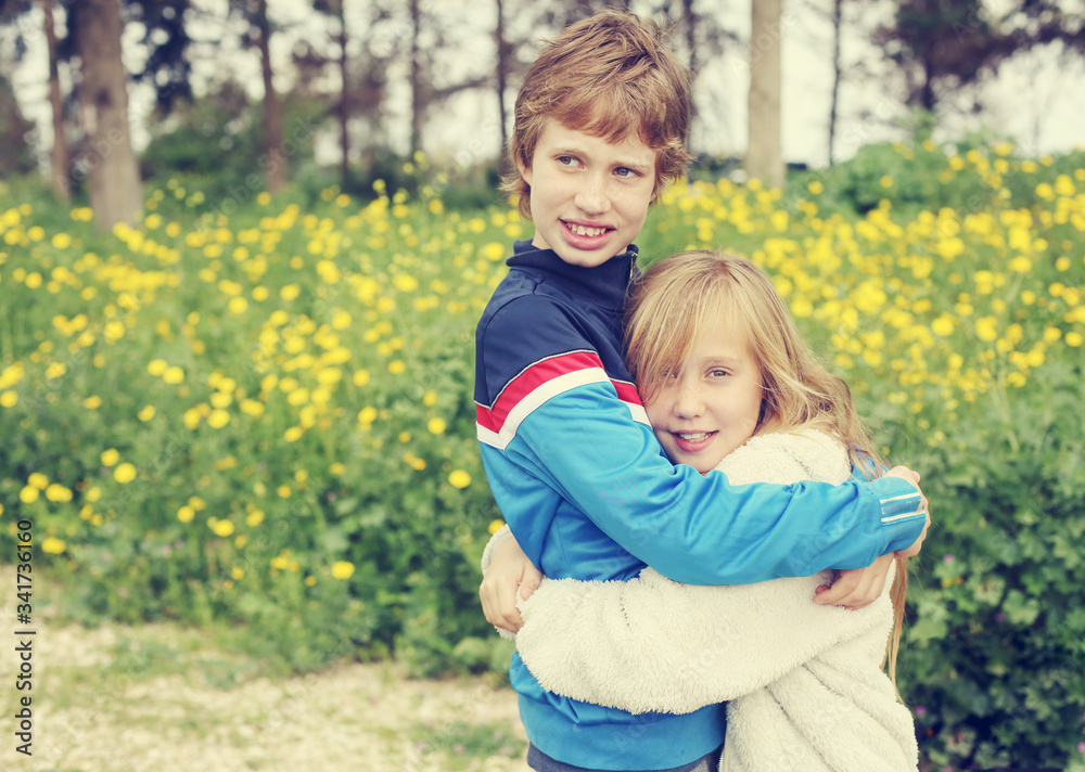 Portrait of sister with her autistic brother enjoying freedom and summer. Ending coronavirus quarantine, out of covid-19 quarantine. Portrait of sister with her autistic brother enjoying freedom and summer. Ending coronavirus quarantine, out of covid-19 quarantine.