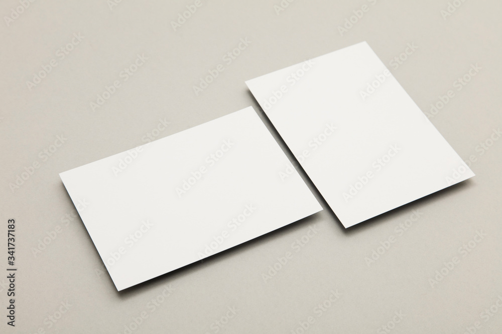 business card flyer poster mock up. White card on a grey background business card flyer poster mock up. White card on a grey background