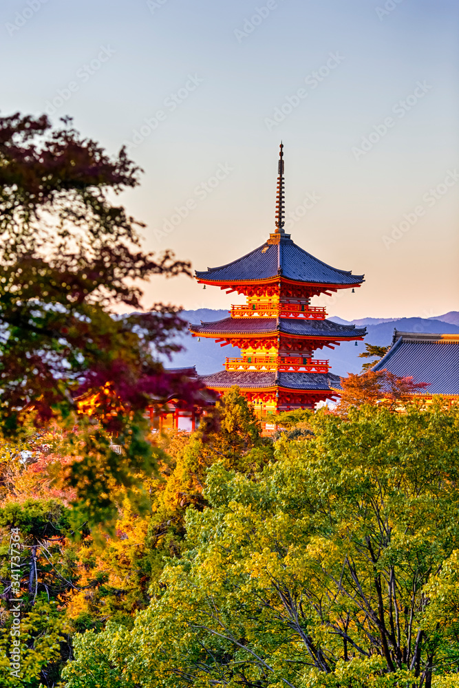 Renowned Kiyomizu-dera Temple Pagoda Against Traditional Autumn Red Maple Trees in Background in Japan. Renowned Kiyomizu-dera Temple Pagoda Against Traditional Autumn Red Maple Trees in Background in Japan.