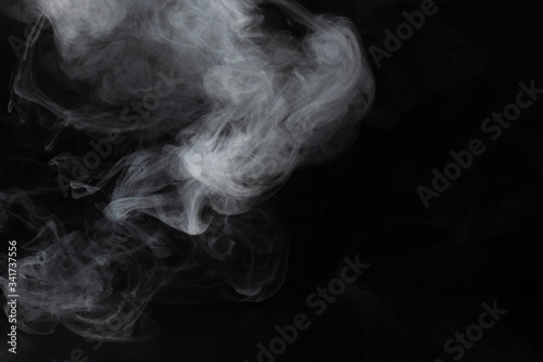 White steam on a black background.