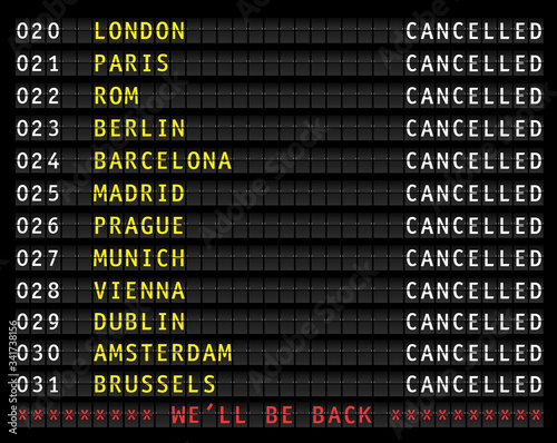 Flight information display showing cancelled flights because of corona shutdown, displaying the message we'll be back
