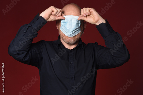 man who takes off the medical mask badly